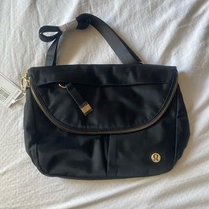 BNWT Black with gold hardware Lululemon all night festival bag 5L